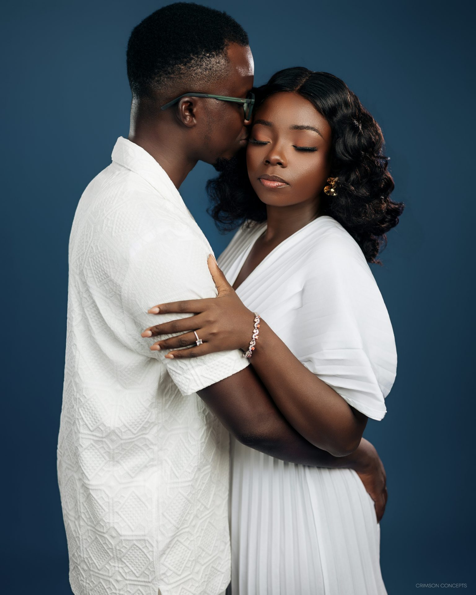 Couple photography by Crimson Concepts, Accra Ghana — studio embrace portrait