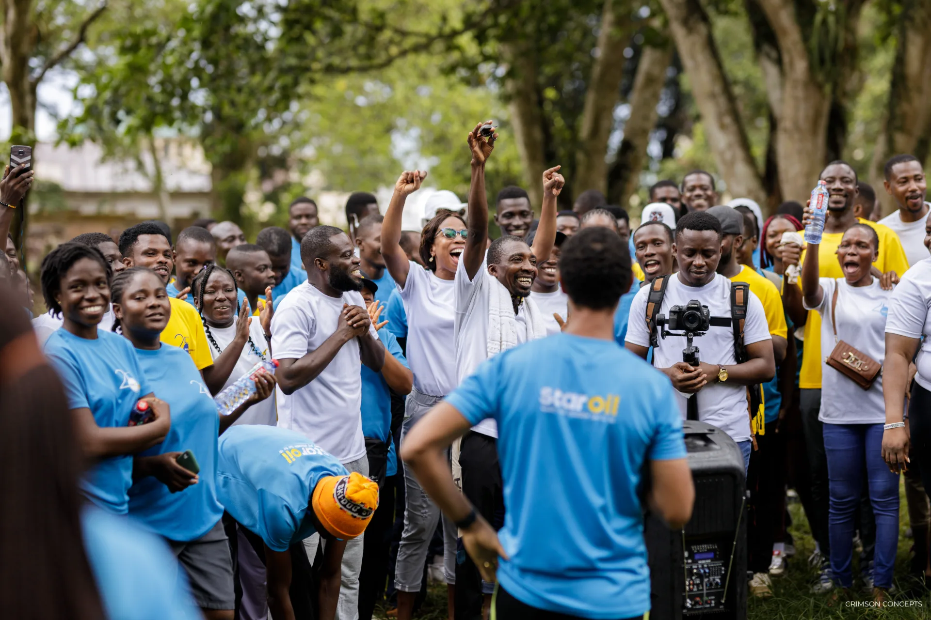 Event photography by Crimson Concepts, Accra Ghana — group photo, outdoor community event Star Oil