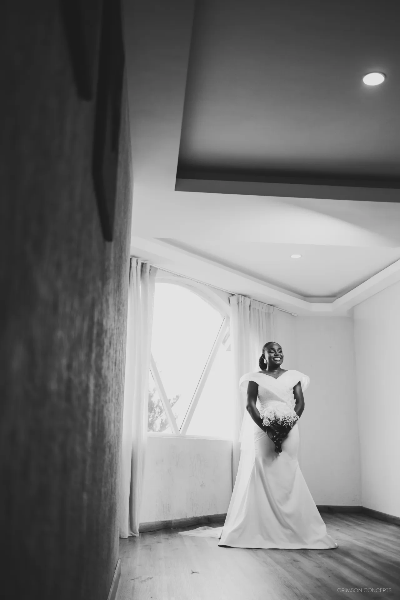 Wedding photography by Crimson Concepts, Accra Ghana — black and white bridal portrait, hallway