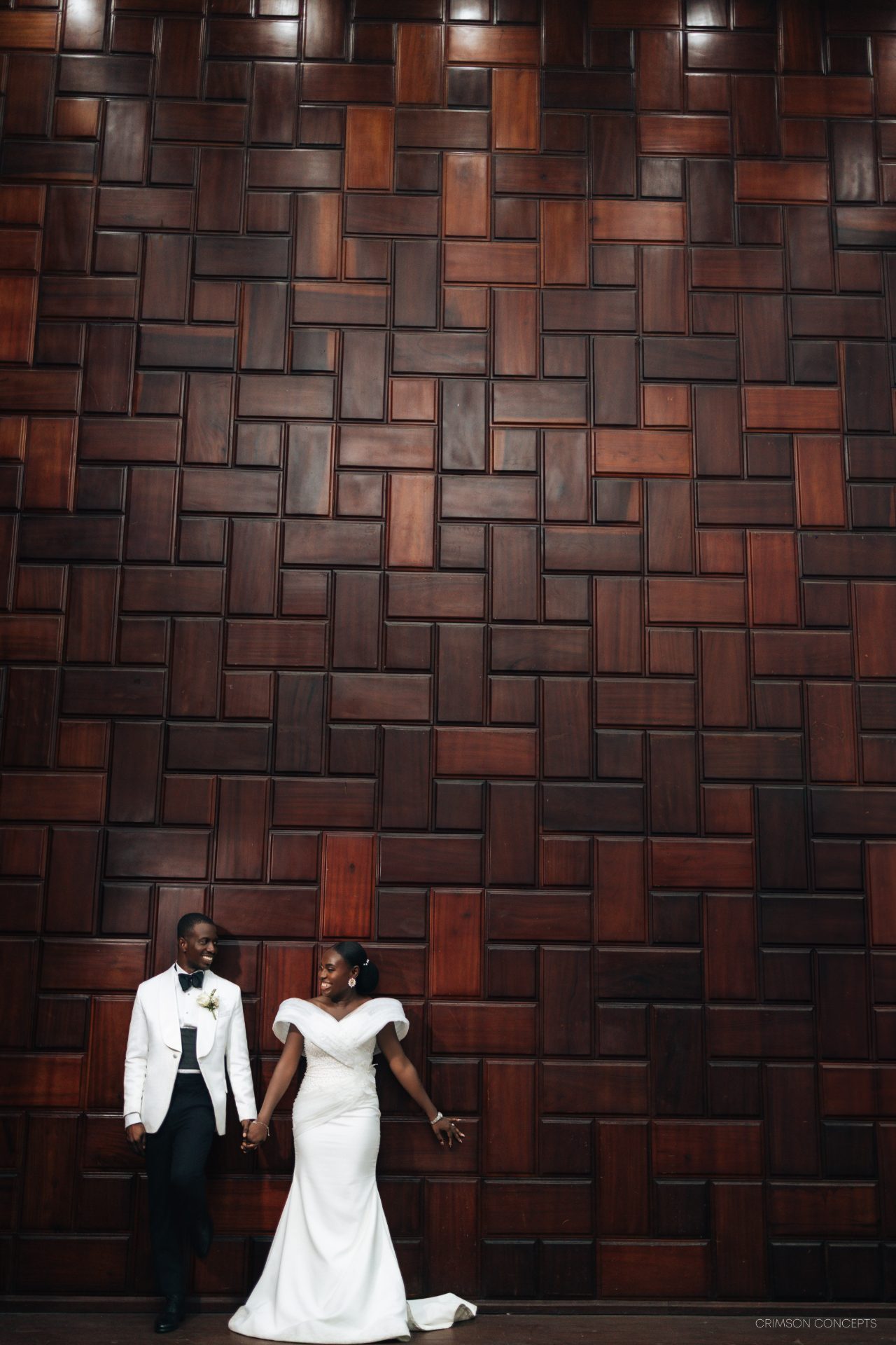 Wedding photography by Crimson Concepts, Accra Ghana — couple silhouette, brick backdrop