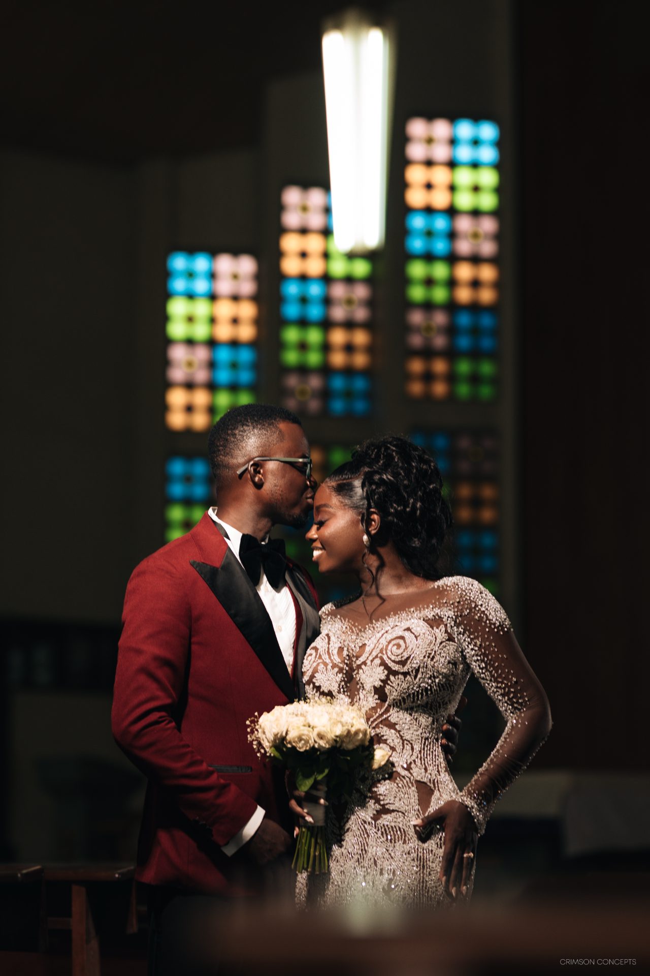 Wedding photography by Crimson Concepts, Accra Ghana — church ceremony forehead kiss