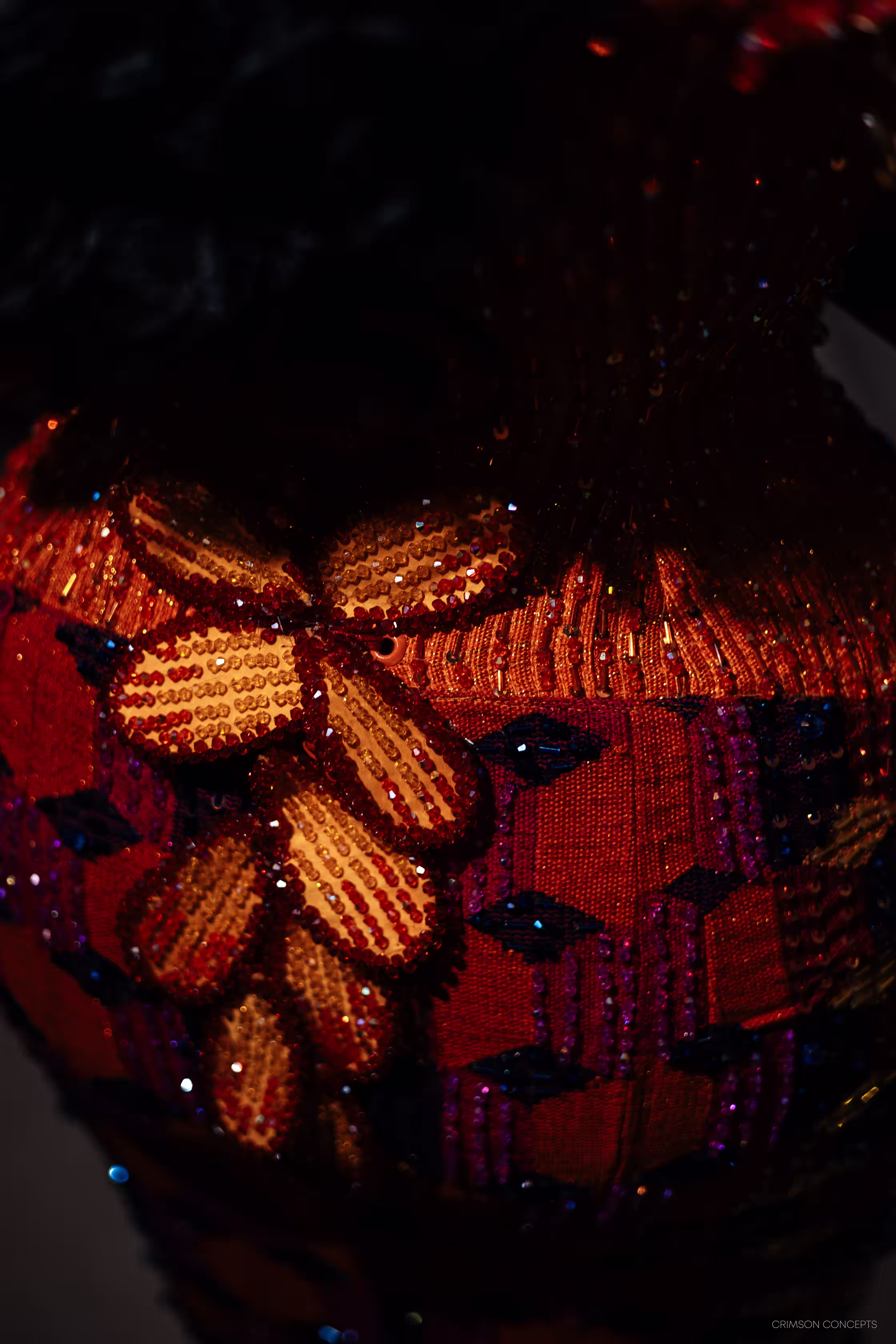 Macro detail of the intricate beadwork on Cassie's wedding gown