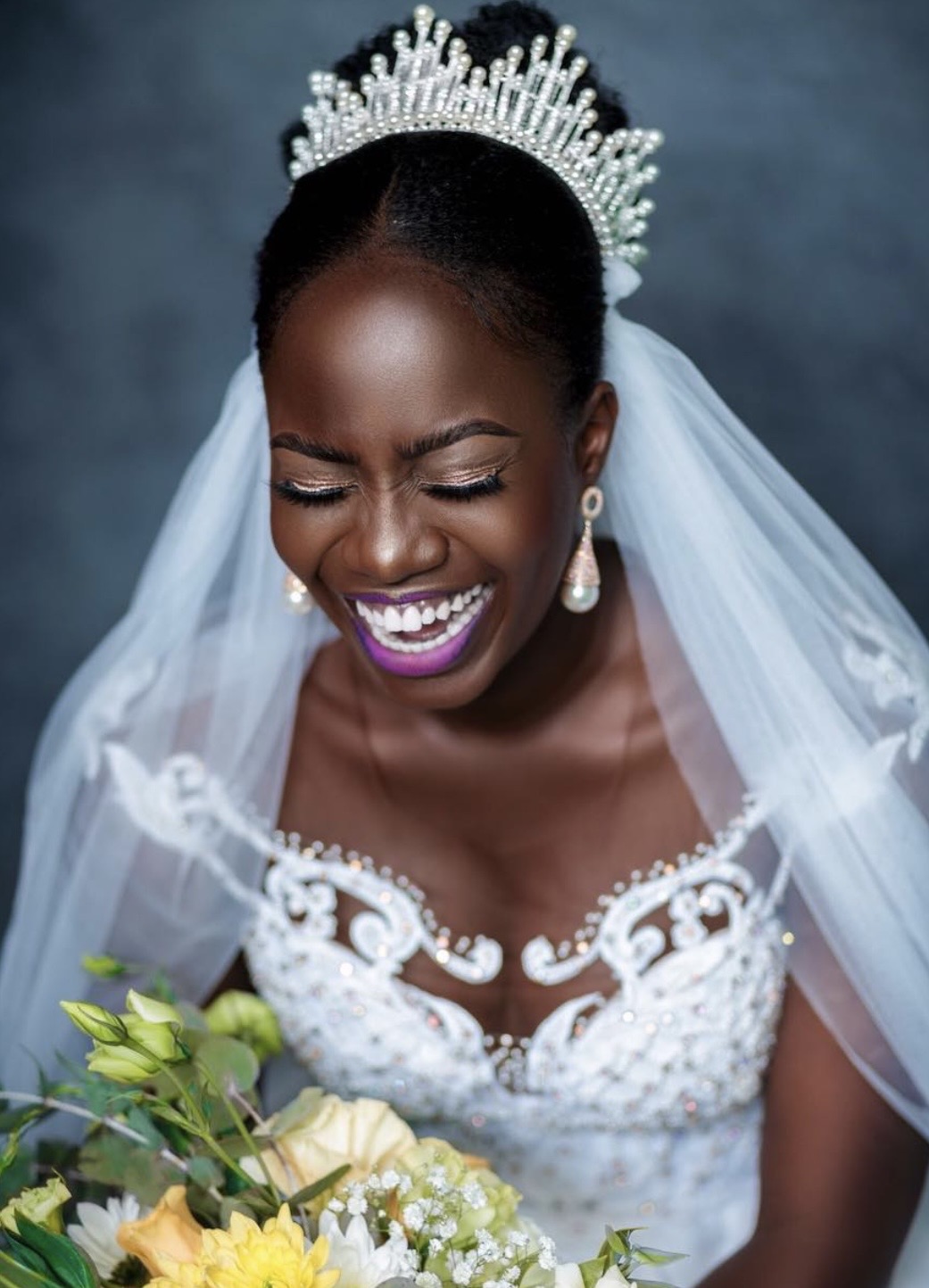 Subito white wedding collection — joyful bride portrait with bouquet, Crimson Concepts, Accra Ghana
